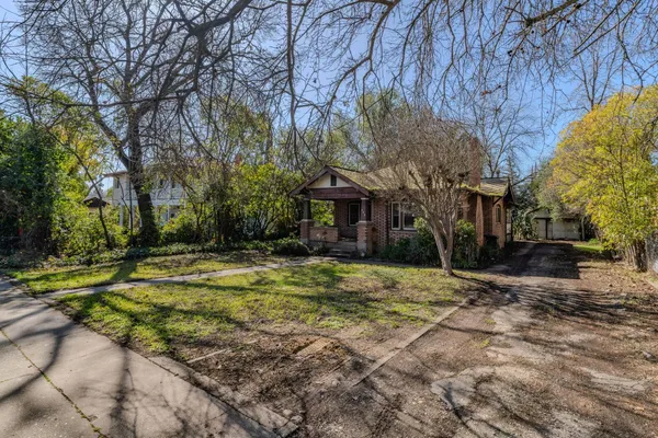 a view of a trees in front of a house