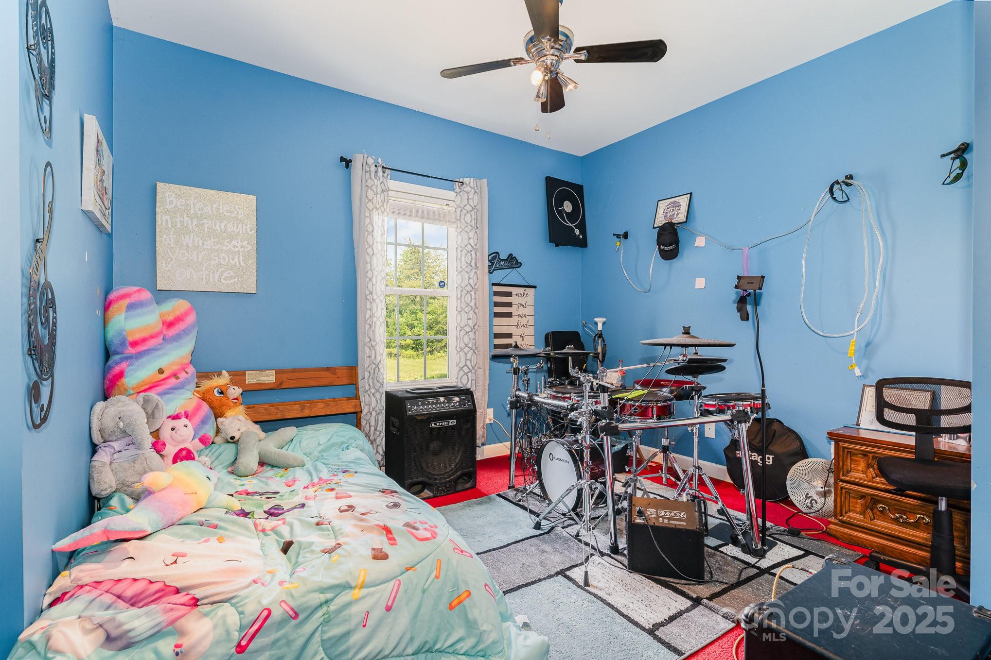 4242 Lake Ridge Court Ramseur, NC 27316 - Photo 24 of 33 a bedroom with baby bed and a window