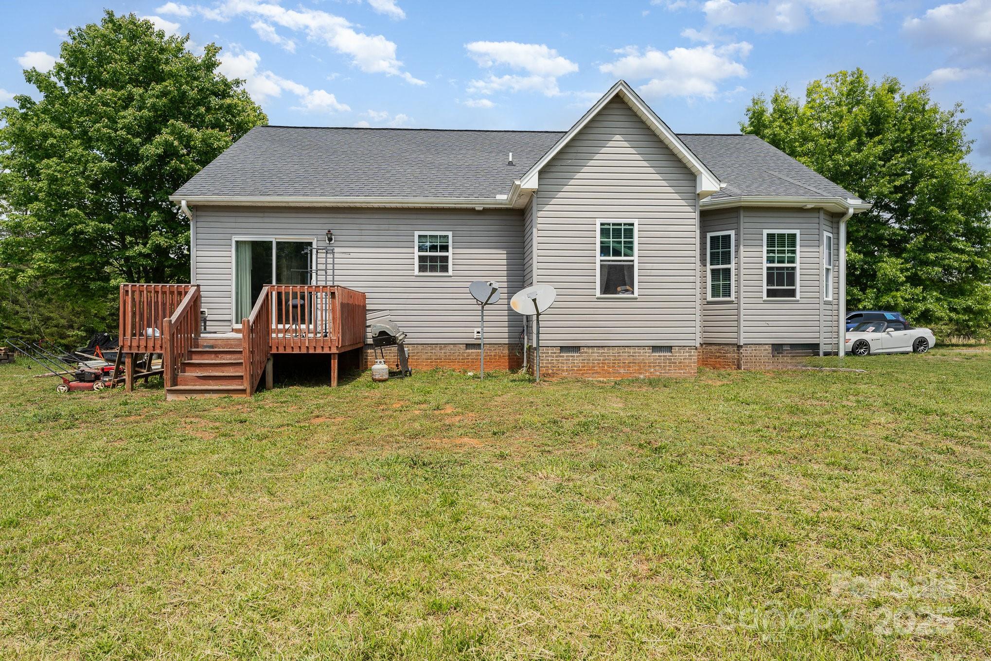 4242 Lake Ridge Court Ramseur, NC 27316 - Photo 29 of 33 a front view of house with yard and trees