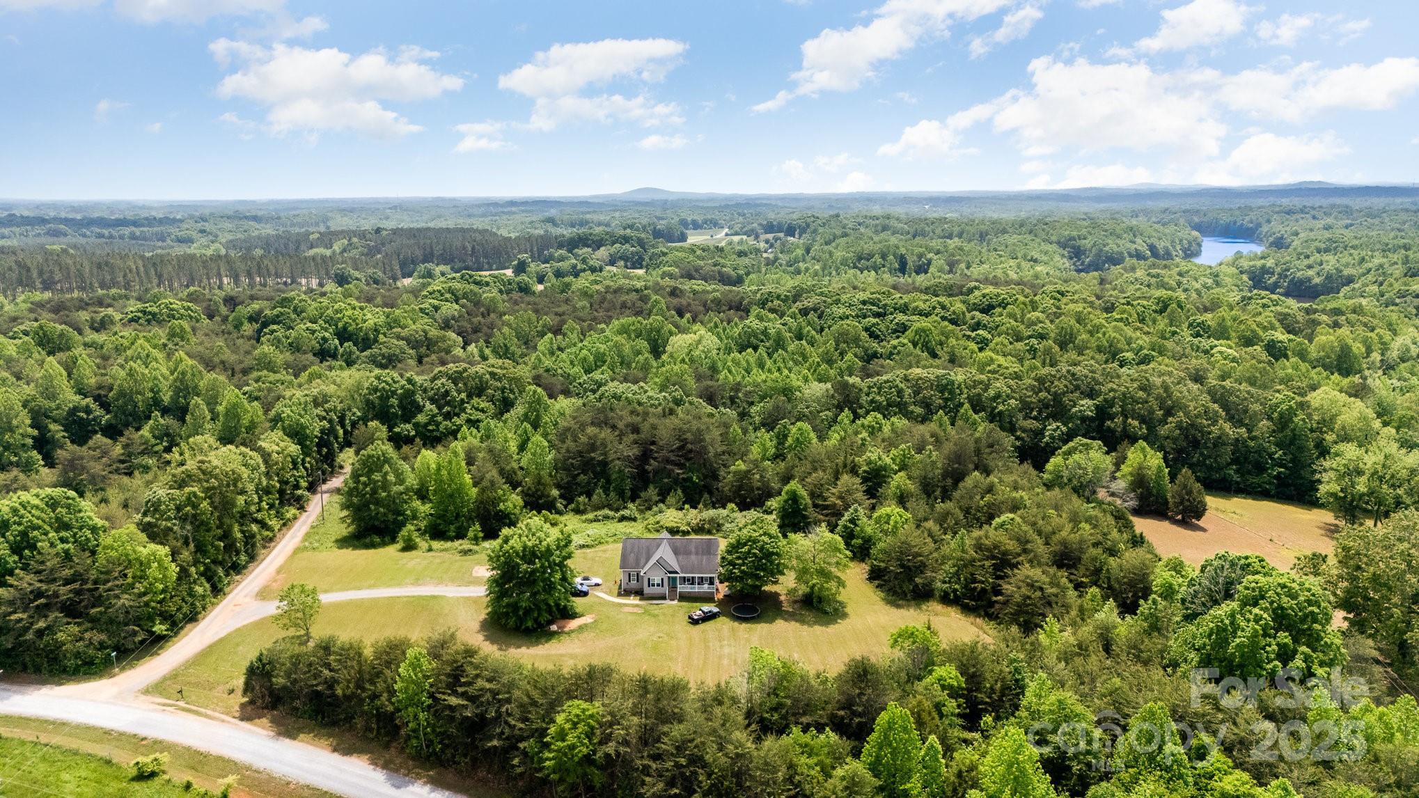 4242 Lake Ridge Court Ramseur, NC 27316 - Photo 3 of 33 a view of a lake with a city