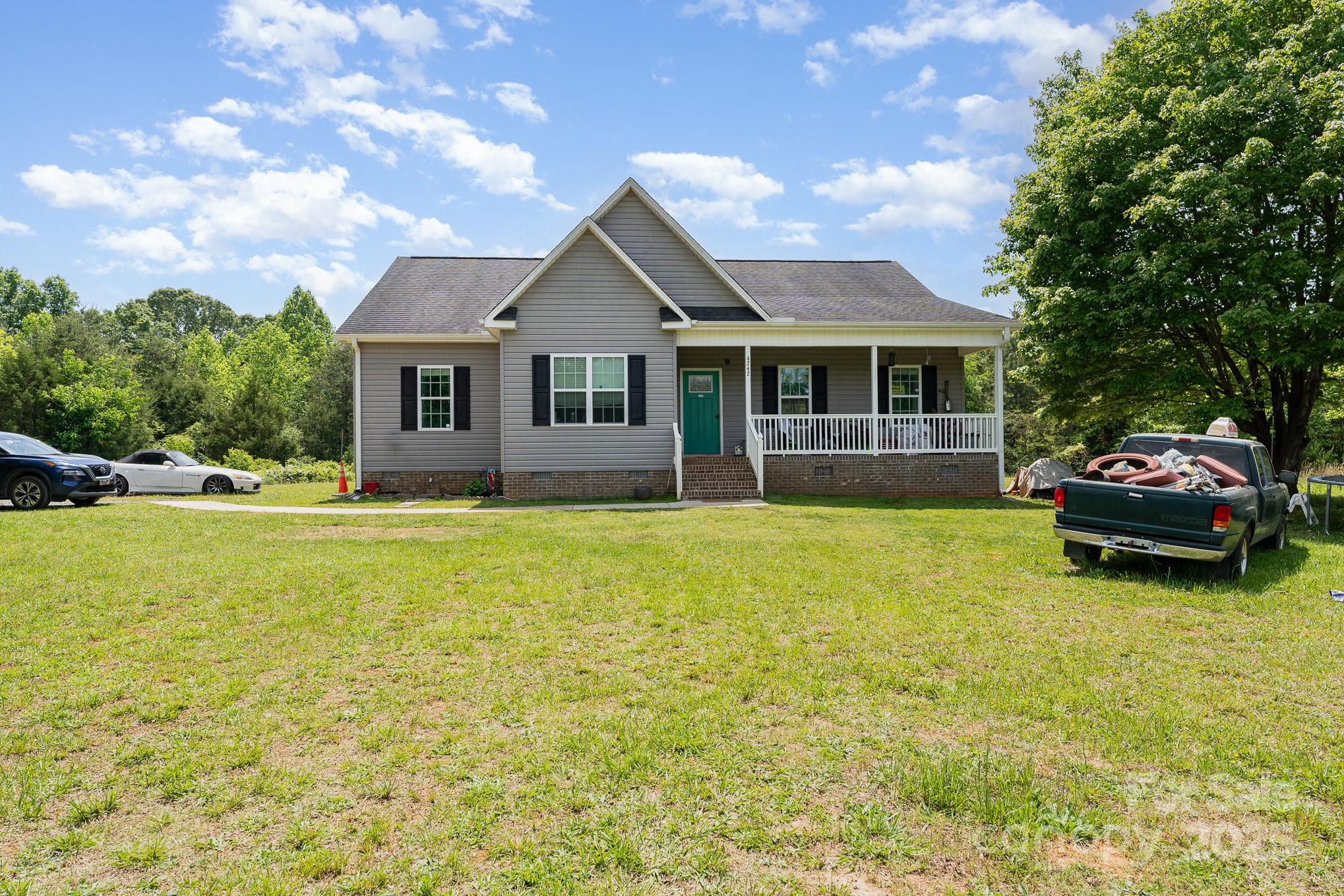 4242 Lake Ridge Court Ramseur, NC 27316 - Photo 8 of 33 a front view of house with yard and swimming pool