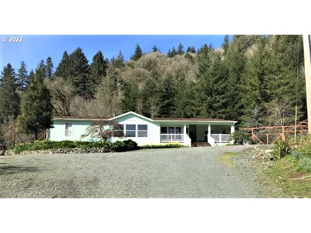 56246 Baker Road Coquille, OR 97423 - Photo 1 of 31 a house view with a garden space