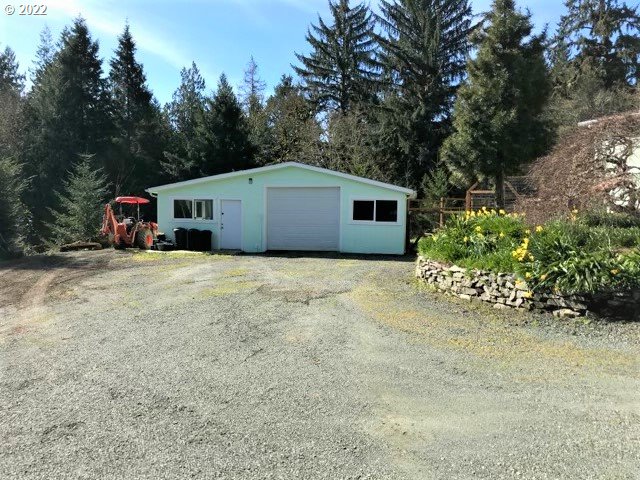 56246 Baker Road Coquille, OR 97423 - Photo 2 of 31 a house with trees in front of it