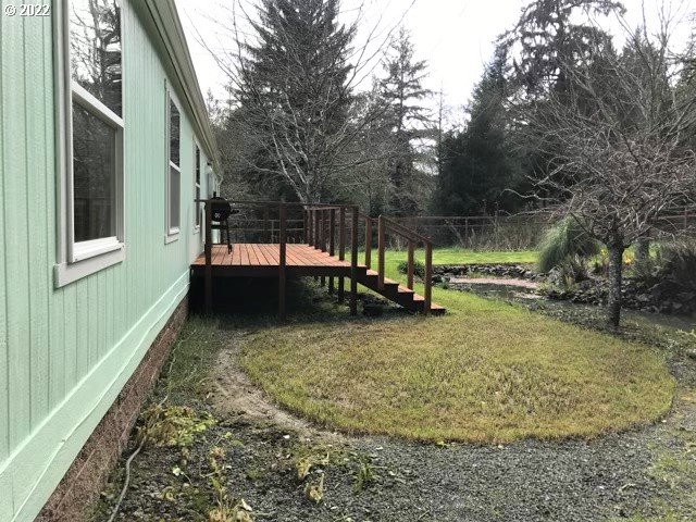 56246 Baker Road Coquille, OR 97423 - Photo 6 of 31 a backyard of a house with lots of green space