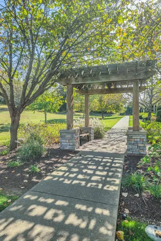 a wooden bench sitting in middle of garden