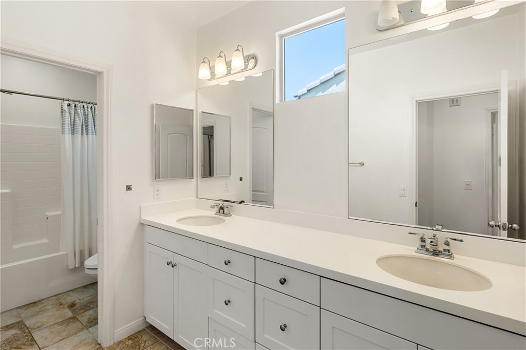421 Maravilla Lane Brea, CA 92823 - Photo 13 of 22 a bathroom with double vanity sinks and a mirror