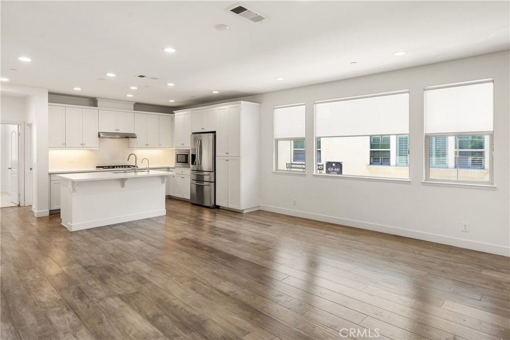 421 Maravilla Lane Brea, CA 92823 - Photo 6 of 22 a view of kitchen with wooden floor and electronic appliances