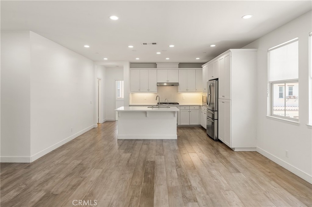 421 Maravilla Lane Brea, CA 92823 - Photo 7 of 22 a view of kitchen with wooden floor and window