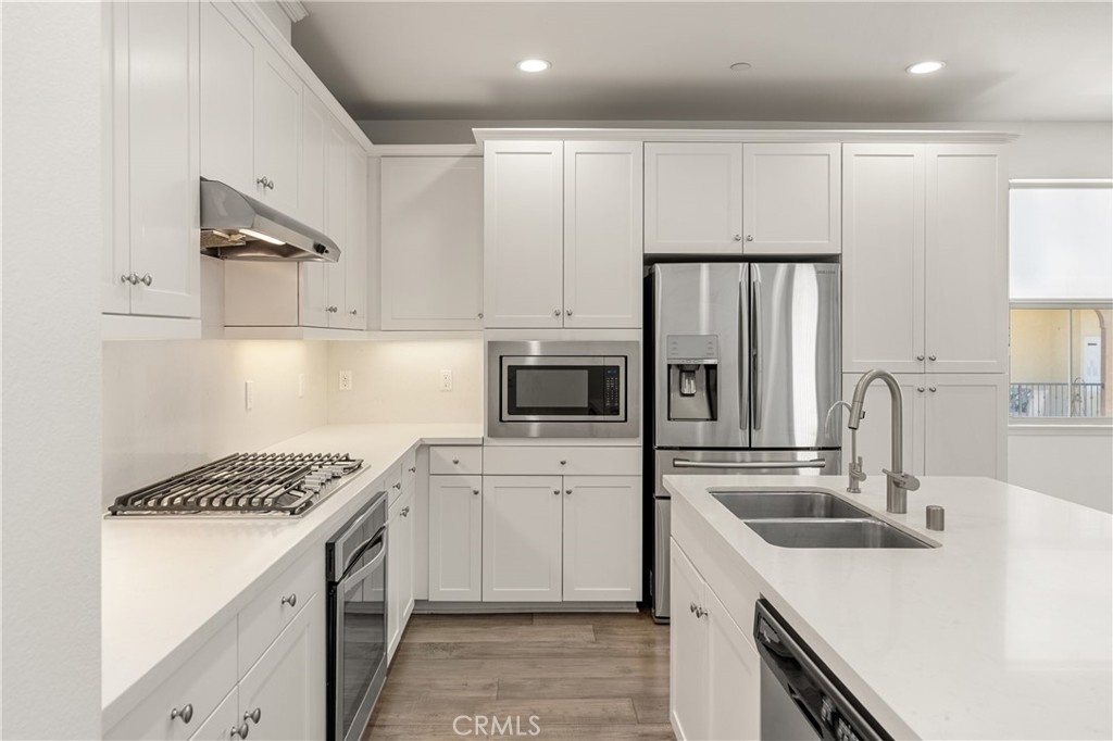 421 Maravilla Lane Brea, CA 92823 - Photo 9 of 22 a kitchen with a sink stove and refrigerator