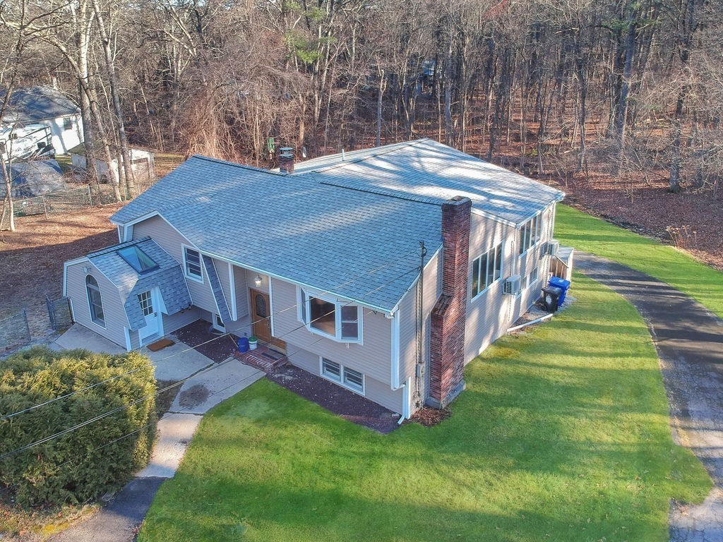 8 Cheney Drive Hudson, NH 03051 - Photo 2 of 42 a view of a house with a yard