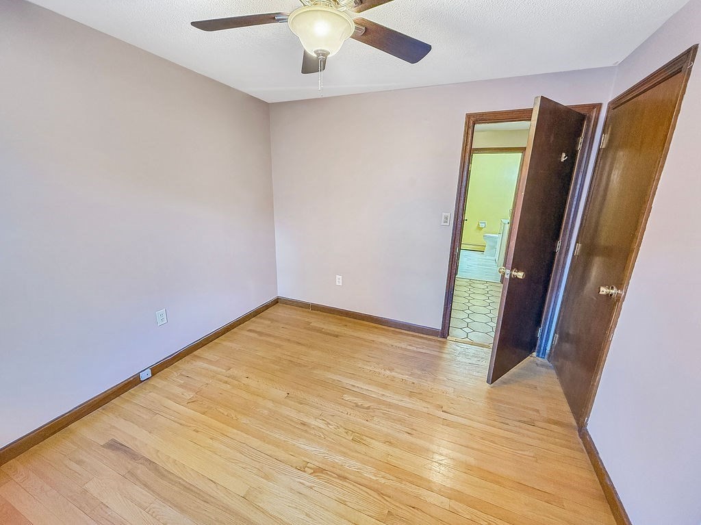 8 Cheney Drive Hudson, NH 03051 - Photo 24 of 42 wooden floor in an empty room with a window