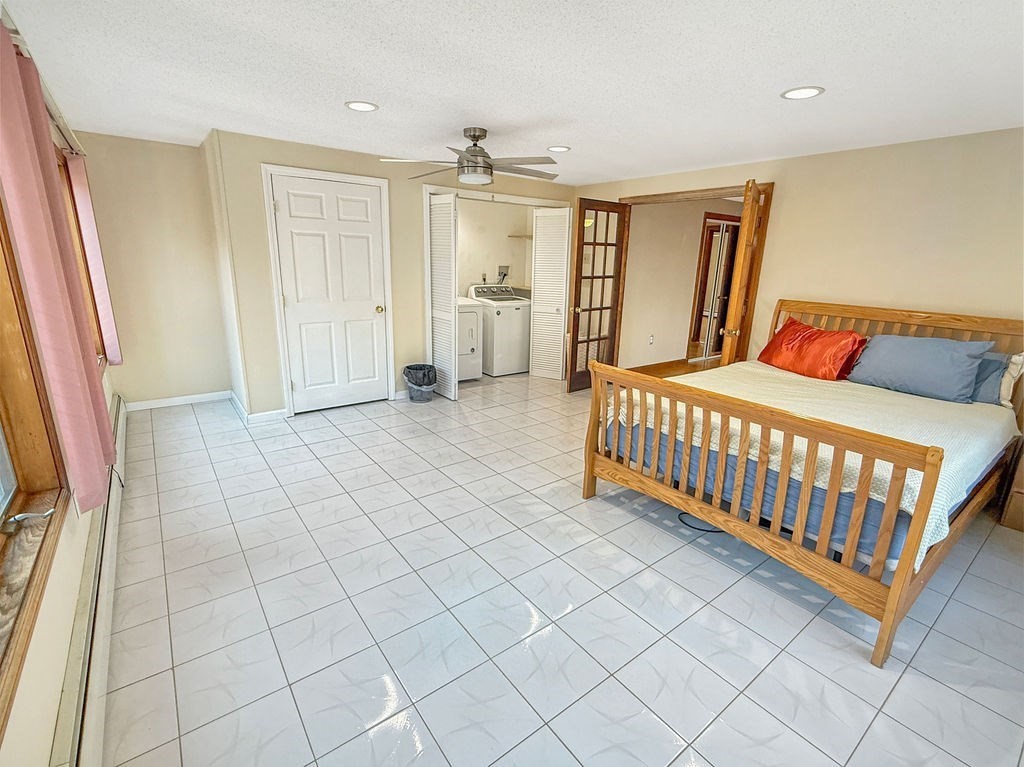 8 Cheney Drive Hudson, NH 03051 - Photo 31 of 42 a room with a baby crib furniture and a window