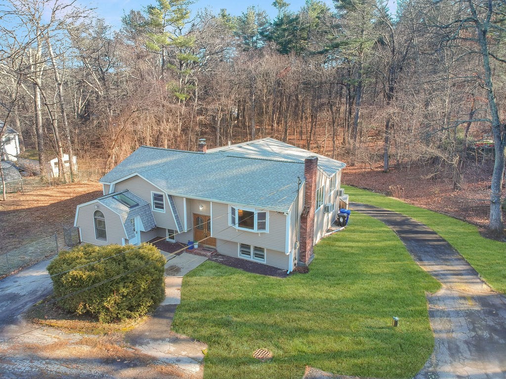 8 Cheney Drive Hudson, NH 03051 - Photo 42 of 42 a aerial view of a house next to a big yard and large trees