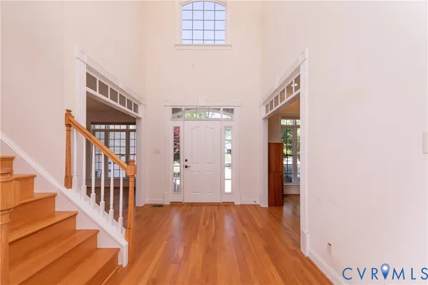 a view of an entryway with wooden floor