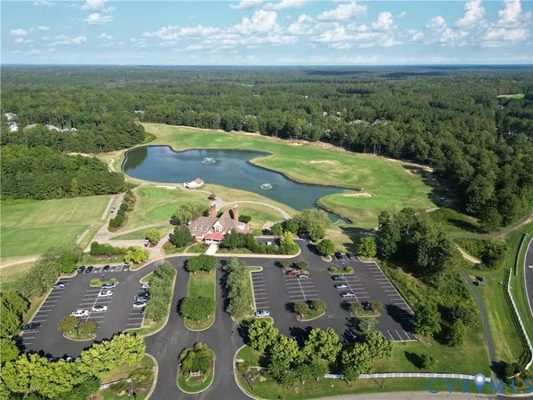an aerial view of house with yard swimming pool and outdoor seating