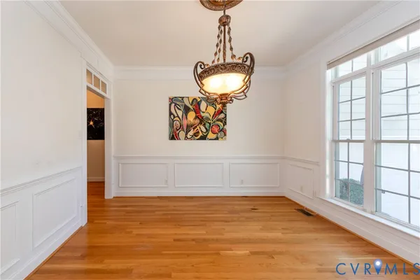 a room with wooden floor and window