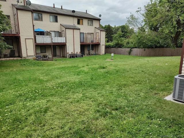 a view of house with yard