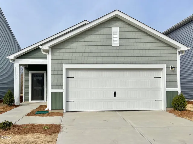 a view of house with garage