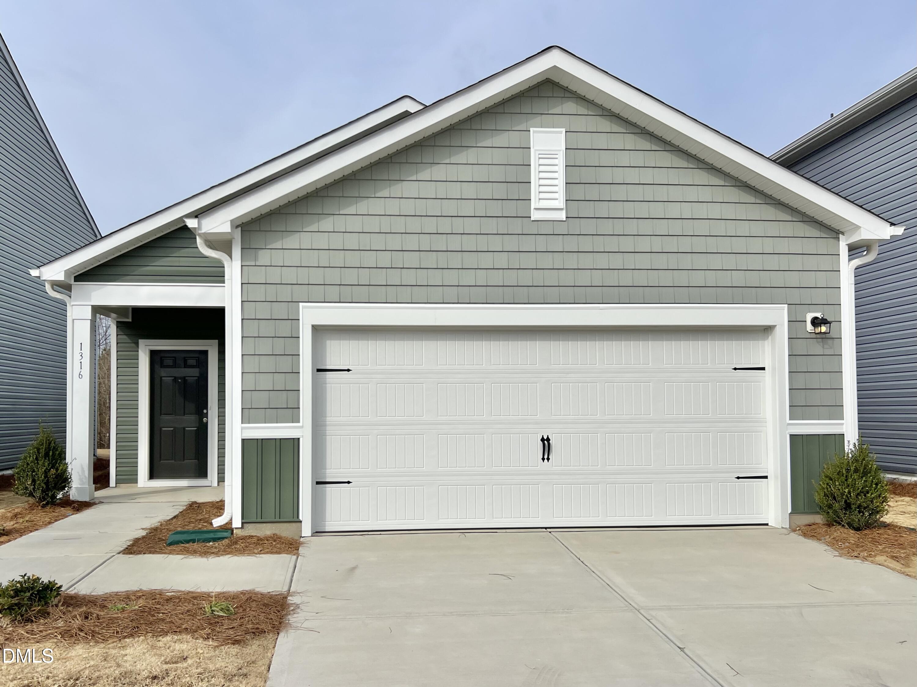 1316 Solace Way Rolesville, NC 27571 - Photo 1 of 29 a view of house with garage