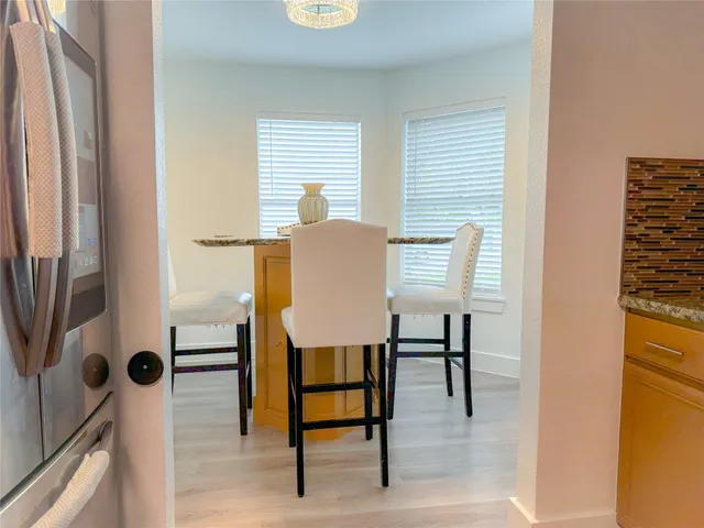 a view of kitchen with furniture and a window