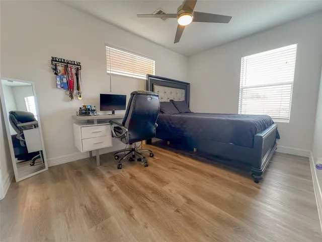 a living room with a bed furniture and a window
