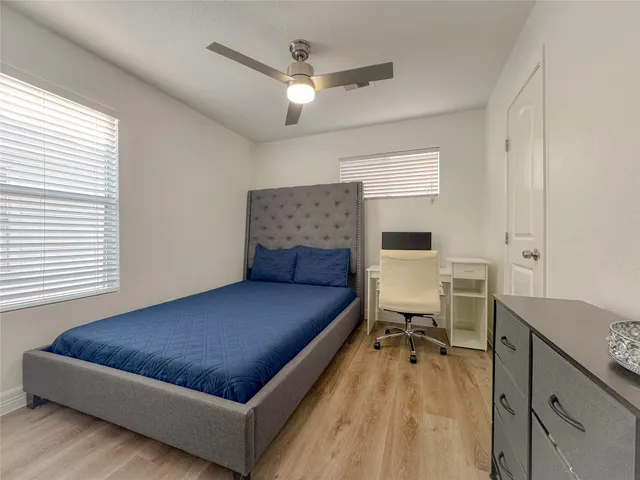 a bed room with a bed furniture and a window