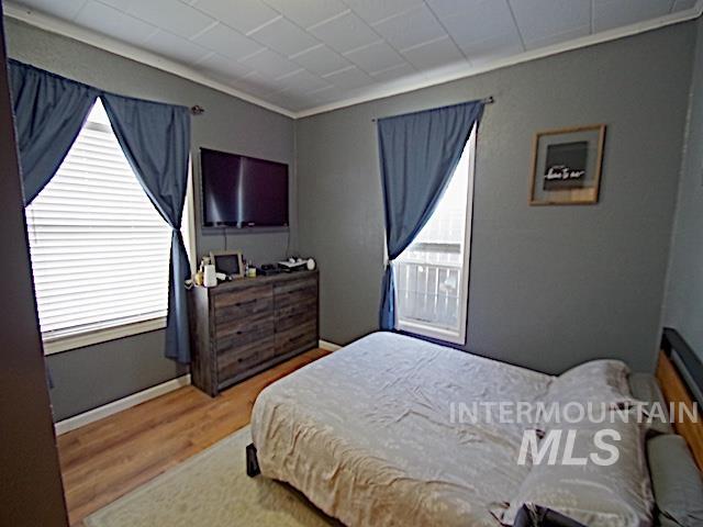 628 3rd Avenue South Payette, ID 83661 - Photo 9 of 19 Bedroom featuring light wood-type flooring and multiple windows