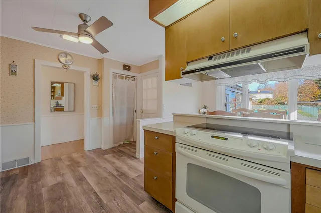 a kitchen with a stove oven and a refrigerator