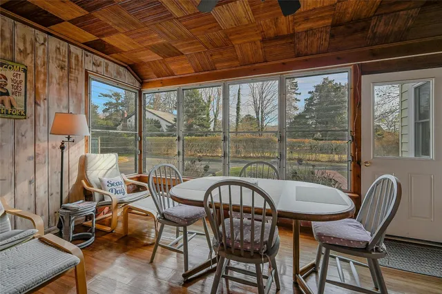 a view of a dining room with furniture window and outside view