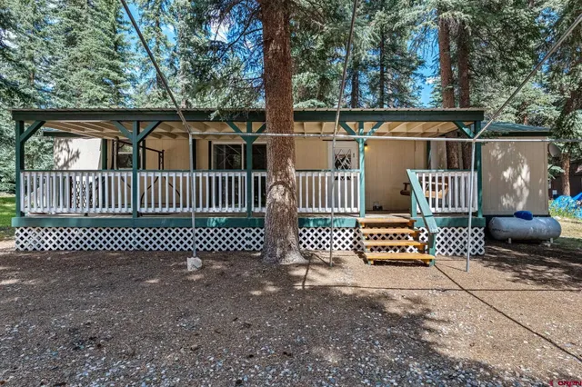 a view of outdoor space with deck and furniture