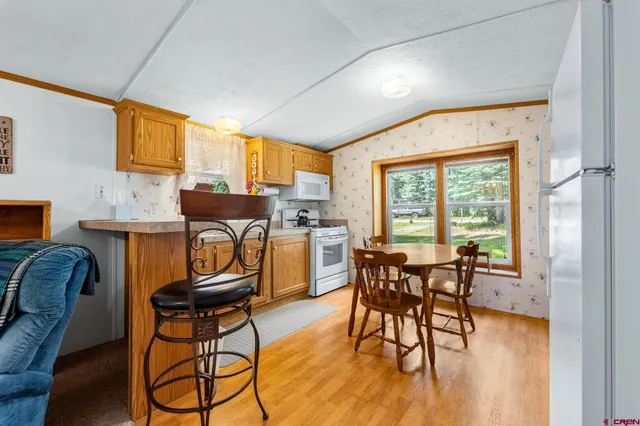 a kitchen with a sink appliances and cabinets