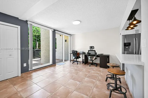 a view of kitchen with furniture and window