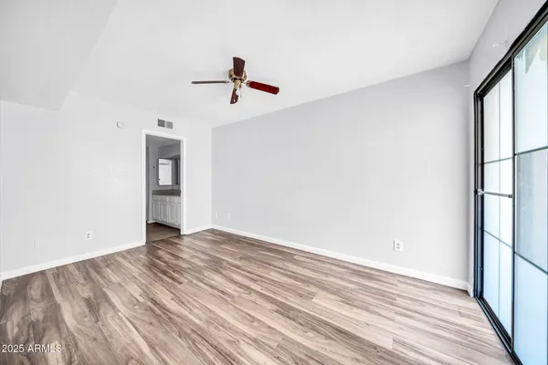 a view of room window and wooden floor