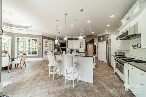 a bathroom with a toilet sink vanity and mirror