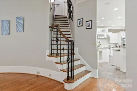 a bathroom with a toilet a sink and a mirror