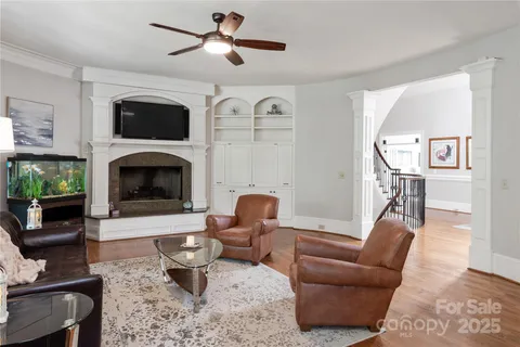 a bathroom with a granite countertop toilet a sink and a mirror