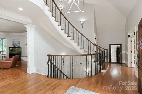 a bedroom with a bed a couch and a larger window