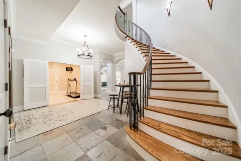 a large kitchen with stainless steel appliances kitchen island granite countertop a large stove a sink and a microwave