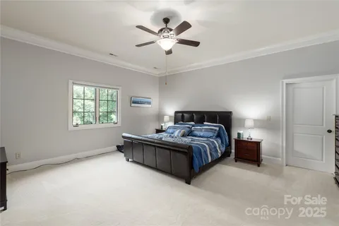 a room with furniture pool table and windows