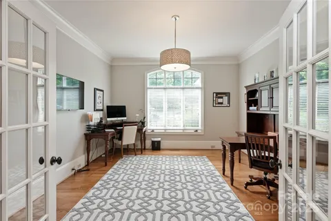 a large kitchen with a table and chairs