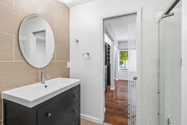 a bathroom with a toilet sink and shower