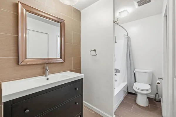 a view of a bathroom from a hallway