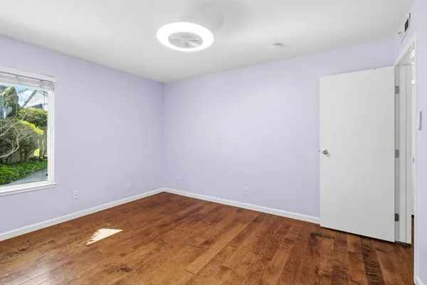 a view of an empty room with a closet