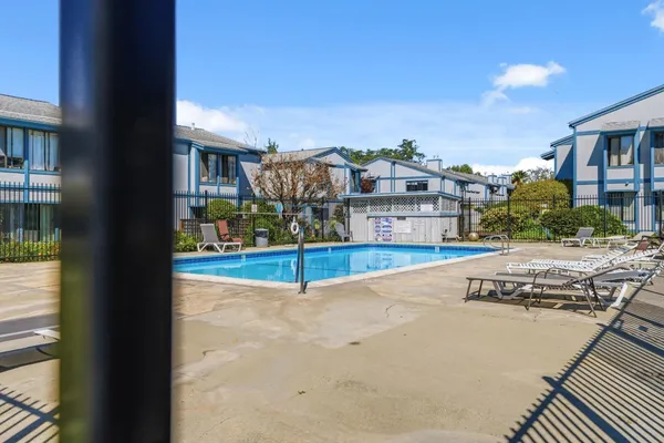 a view of a swimming pool with a patio