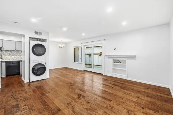 a view of a kitchen with a sink and cabinets