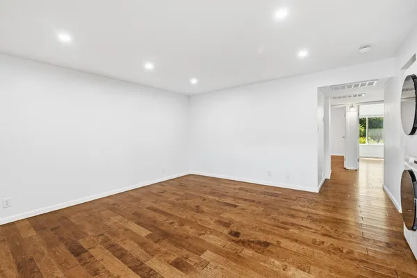 a view of an empty room with a window