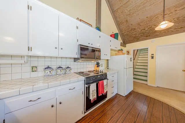 a very nice looking room with a sink and wooden floor