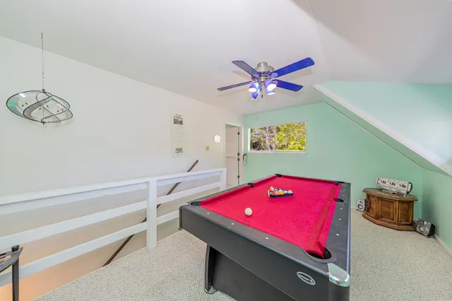 a kitchen with stainless steel appliances granite countertop a stove a sink and a wooden floors
