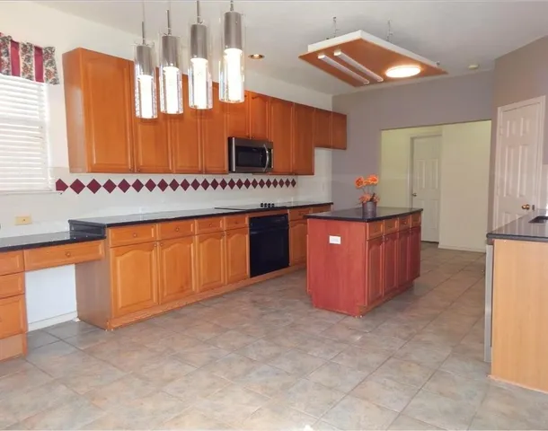 a room with cabinets and wooden floor