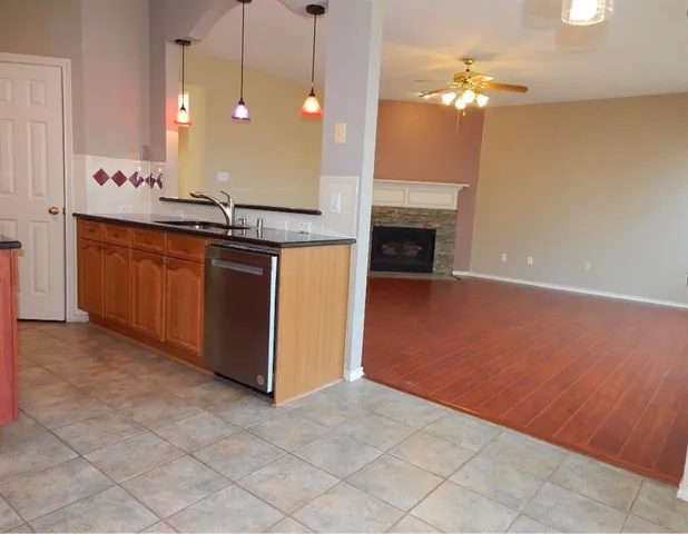 a room with fireplace and chandelier